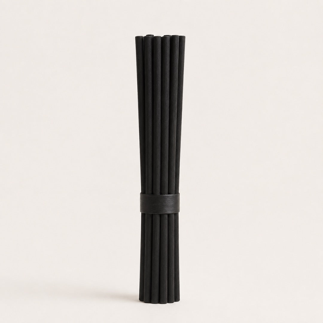 Pack of 6 black reed diffuser replacement reeds on a light background.