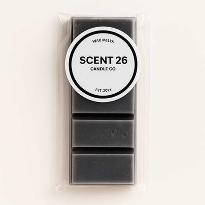 45g Black Pomegranate wax melt snap bar with 5 rich rectangular sections, dark crimson colour with a velvety finish, fragranced with exotic pomegranate, spicy pink pepper, and warm patchouli undertones