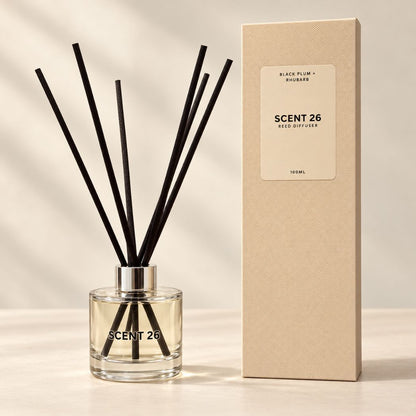 Scent 26 Reed Diffuser with premium presentation box. Featuring an elegant glass bottle with black reeds, this handmade UK home fragrance combines fresh, zesty lemongrass with warm, spicy ginger for an uplifting scent.