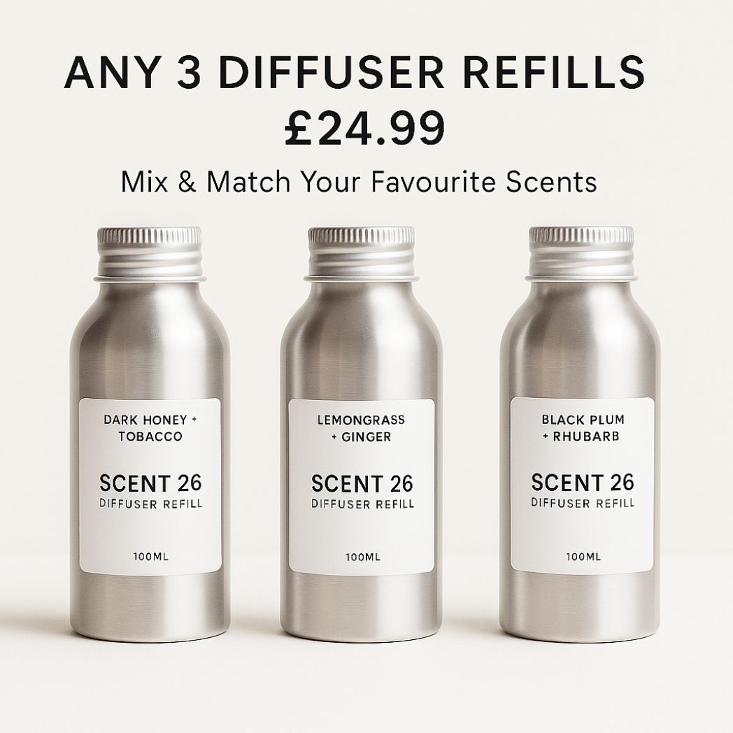 Scent 26 diffuser refills promotional image showing three 100ml aluminium bottles in Dark Honey + Tobacco, Lemongrass + Ginger, and Black Plum + Rhubarb fragrances with text offer reading Any 3 Diffuser Refills £24.99 Mix & Match Your Favourite Scents